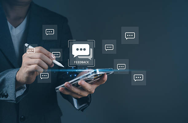 istock Feedback service customer review system with businessman using stylus on smartphone to give opinion digitally via comment icon interface. 2244295628