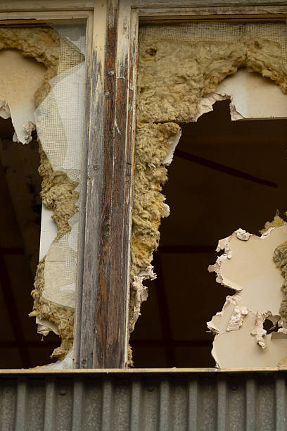 istock A broken window can be found in a building and features a noticeable hole in it 2244295791