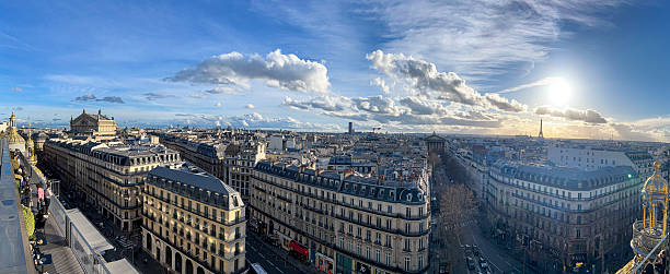istock Stunning panoramic view of Paris rooftops under a clear sky at sunset 2244296063