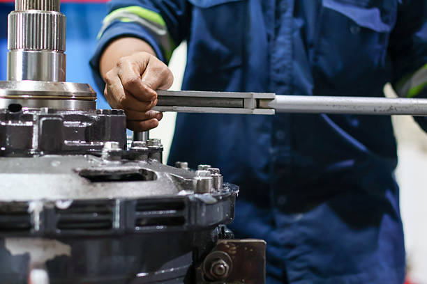 istock Mechanic's hands tightening bolt using a torque wrench 2244296314