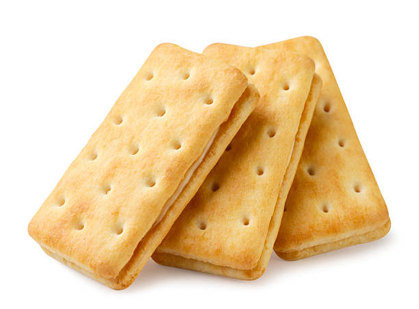 istock Three sandwich cookies close-up on a white. Isolated 2244301887
