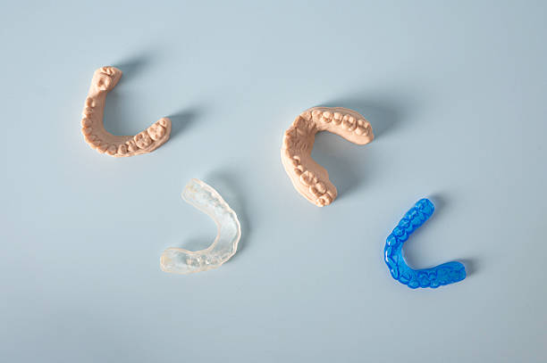 istock Flat Lay of Dental Molds and Night Guards on Light Blue Background 2244302777