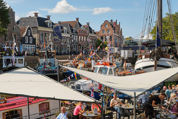 Dokkum, The Netherlands - September 6 2025:  All kinds of different boats with colored flags under a blue sky during de Admiraliteitsdagen or Admiralty Days in Dokkum Friesland The Netherlands