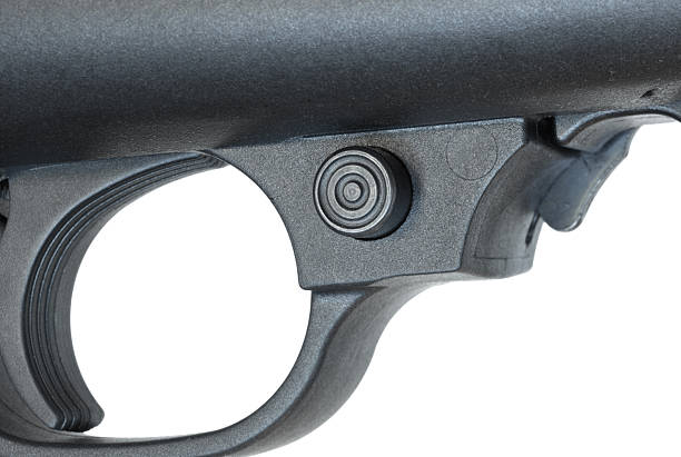 istock Safety on a black polymer stocked rifle 2244308039