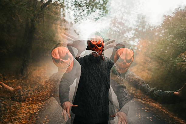 Spooky entity wearing a halloween mask haunting an autumn forest