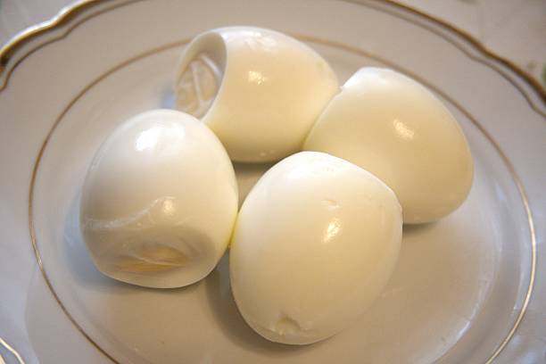 istock Number 4 peeled boiled eggs on a plate, close-up 2244315644