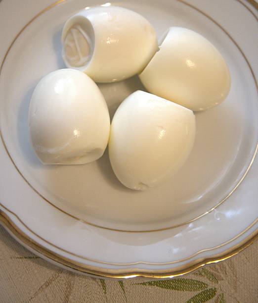 istock Number 4 peeled boiled eggs on a plate, close-up 2244315659