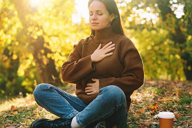 istock Woman doing breathing exercise while outdoor meditation. 2244319946