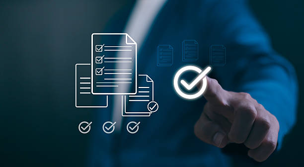 istock Digital Quality Assurance concept. Hand verifying a checklist icon, symbolizing business compliance, standards management, and successful audit completion. 2244321864
