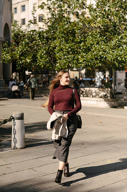 istock Woman walking in a city 2244324957