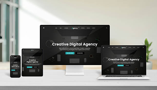 istock Multiple modern devices displaying creative digital agency website interface on a wooden desk, representing responsive web design and professional digital presentation 2244325686