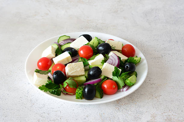 Fresh and Vibrant Greek Salad with Feta cheese, black Olives and cherry Tomatoes