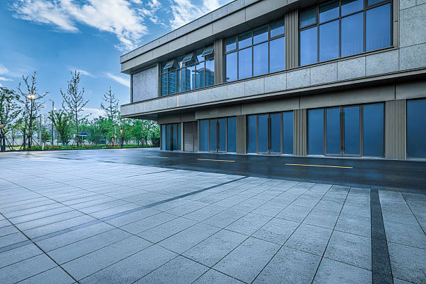 istock Empty stone tile square in front of the entrance to a modern office building. 2244326933