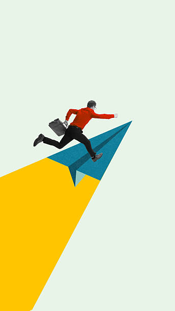 istock Vibrant artwork. Businessman jumping onto paper plane symbolizing ambition and progress 2244327040