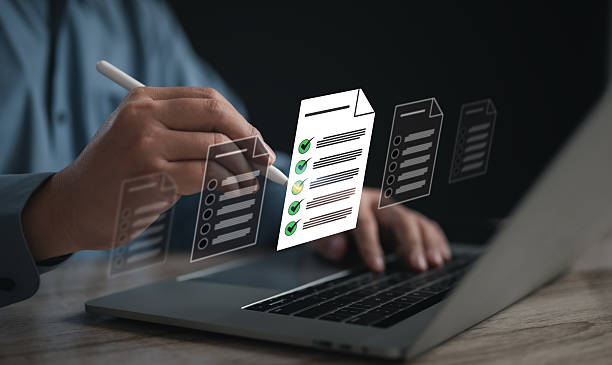 istock Businessman on laptop managing documents and tasks via a DMS. Highlights digital checklists, questionnaires, and online surveys for efficient task tracking 2244327923