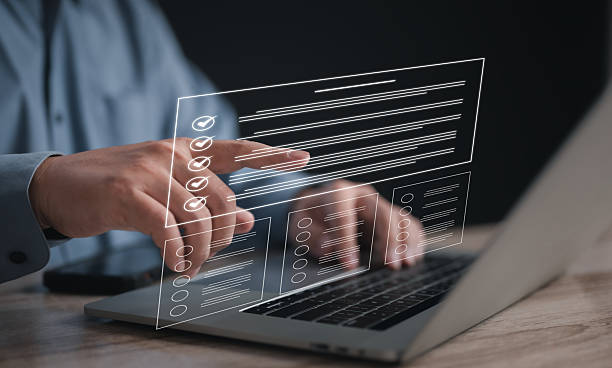 istock Businessman on laptop managing documents and tasks via a DMS. Highlights digital checklists, questionnaires, and online surveys for efficient task tracking 2244328038
