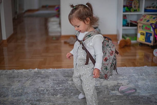 istock Cheerful little girl getting ready for kindergarten 2244331788