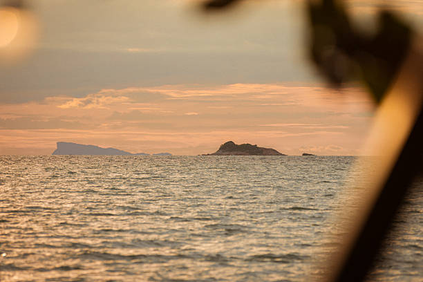 Sun is setting over by the sea at Ko Phangan Island, Thailand.