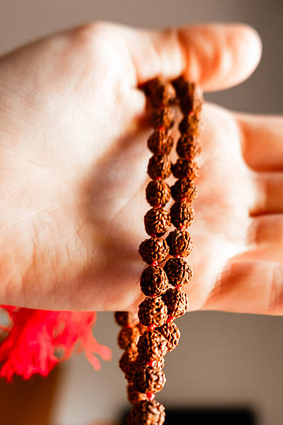 istock Japamala on the hand. Prayer beads. Religious equipment 2244336243