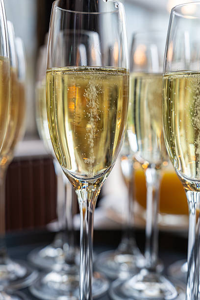 istock Crystal glasses with champagne in festive interior 2244337798
