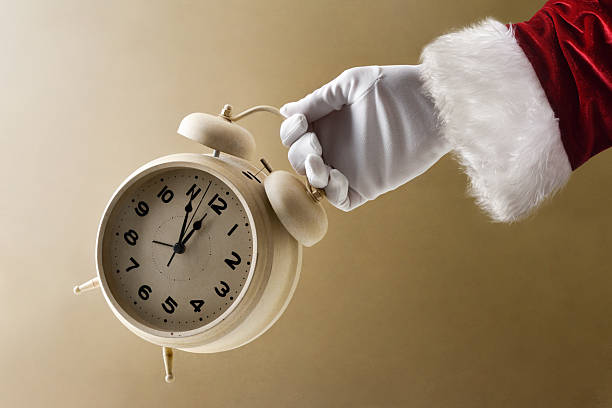 istock Santa Claus showing countdown with clock on New Year's Eve 2244340095