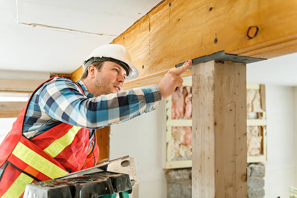istock Inspector with white helmet inspecting an old house to be sure everything is well build checking the beam 2244340202