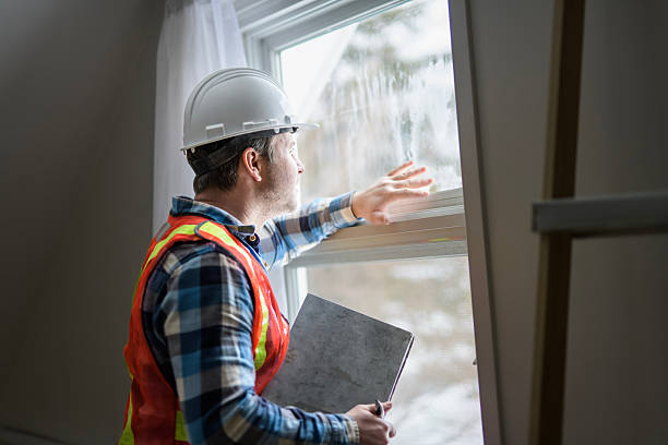 istock Inspector with white helmet inspecting an old house to be sure everything is well build 2244340295