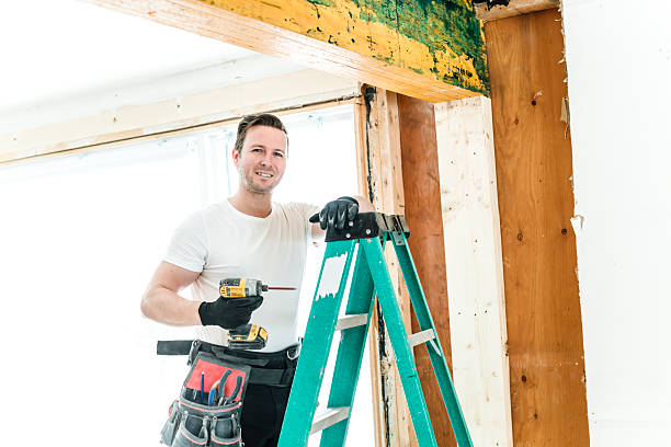 istock Carpenter men working in an old house installing beam 2244340308