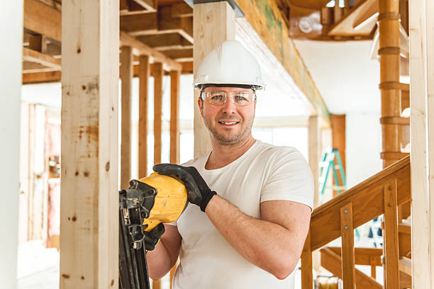 A Carpenter working in an old house