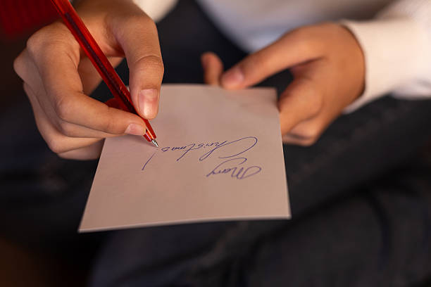 istock Woman is writing a Christmas card 2244340962
