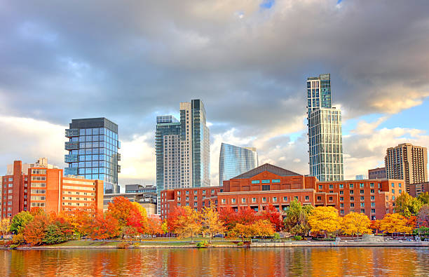 Autumn foliage along the Charles River and the skyline of Boston's West End.
