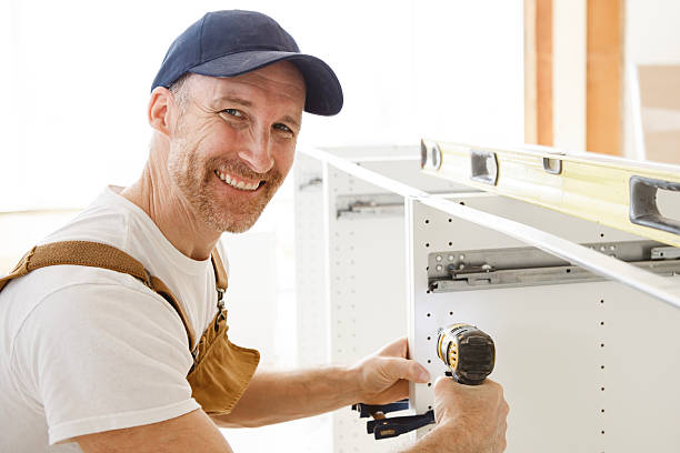 istock Carpenter Installing Luxury Modern Fitted Kitchen in house 2244347180