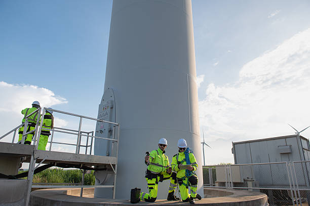 istock Wind Turbine Maintenance and Repair Technician, Engineer Checking Turbines working maintenance clean power generator system 2244347270