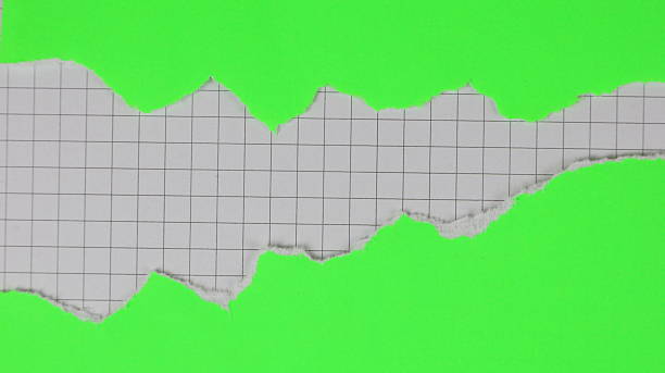 istock Green paper torn in two pieces with a checkered background for copy space 2244349767