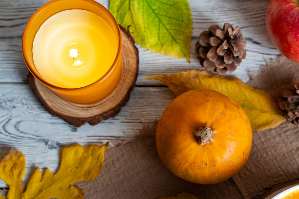 istock Cozy Autumn Still Life with Candle and Pumpkin 2244349803