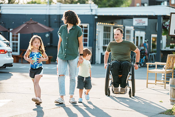 istock Family enjoying sunny afternoon stroll 2244349857
