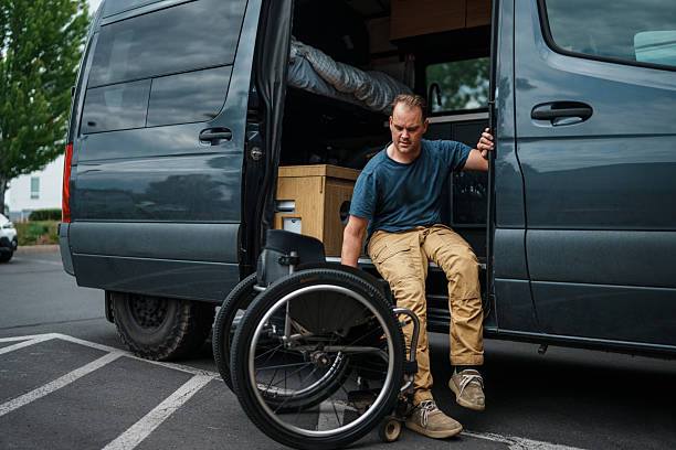 istock Man who uses a wheelchair getting out of van 2244349865