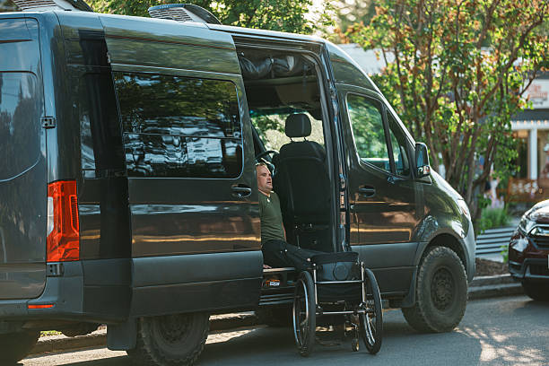 istock Man who uses a wheelchair getting into his van 2244349872