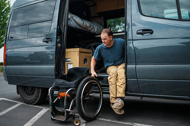 istock Man who uses a wheelchair getting out of van 2244350061