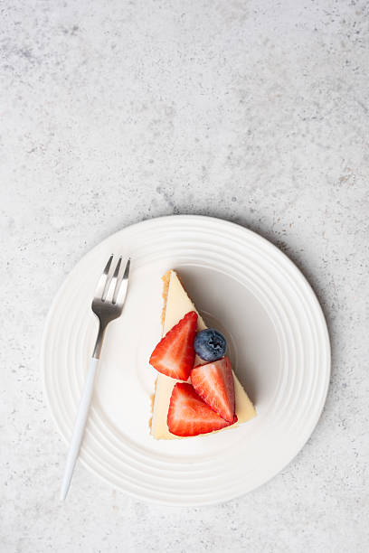 istock Slice of cheesecake with berries 2244351100