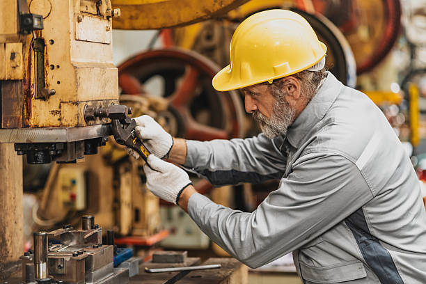 istock Senior engineer expert male machine service work, professional work fixing machine in factory 2244351610