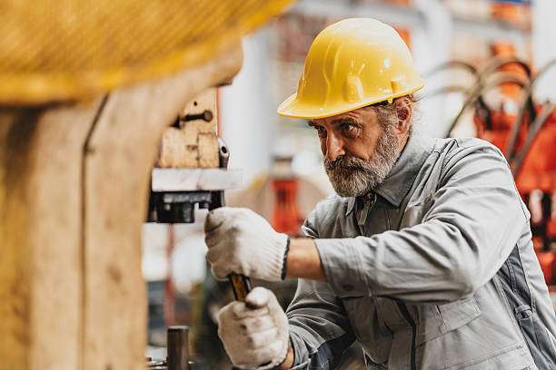 istock Senior engineer expert male machine service work, professional work fixing machine in factory 2244351621