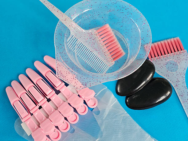 istock Tools for hair coloring session on bright blue background with essential accessories 2244352100