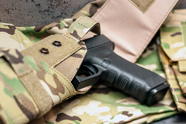 istock handgun in a camouflage holster 2244353013