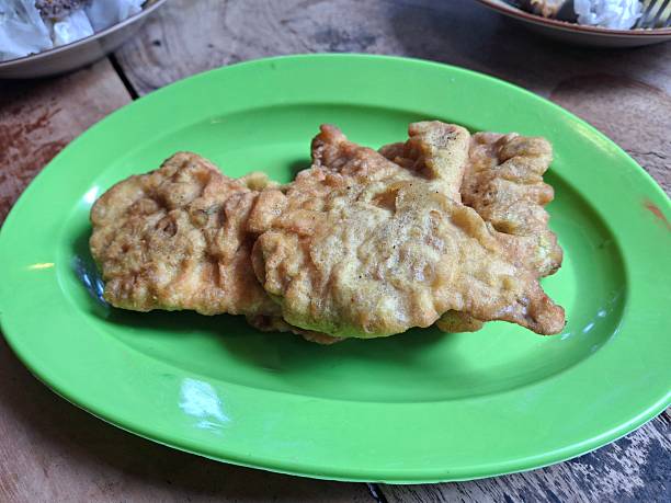 istock Fried food or fried tempeh in flour, placed on a green plate 2244356519