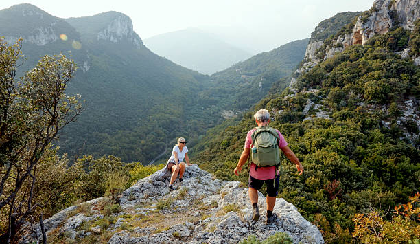 istock Senior couple hikes rugged hilltop, Liguria 2244359028