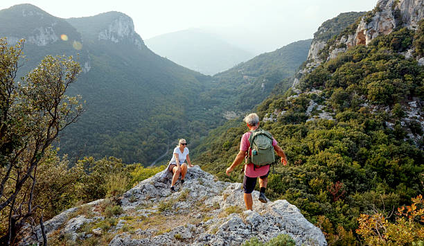 istock Senior couple hikes rugged hilltop, Liguria 2244359029