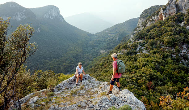 istock Senior couple hikes rugged hilltop, Liguria 2244359031