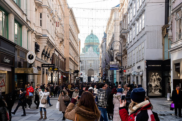 Vienna, Austria - January 06, 2015 - Crowded street scene in vienna with historical architecture and shops.