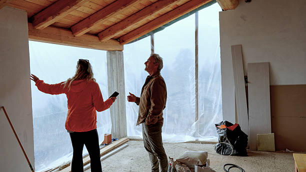 istock Mature couple inside new home construction 2244359453